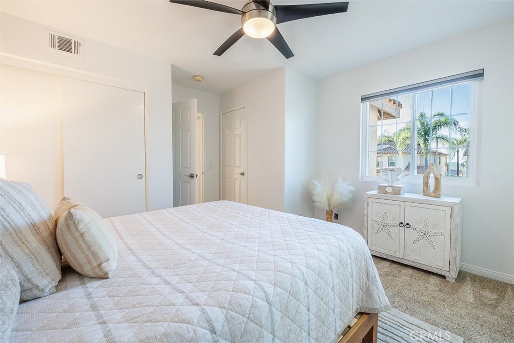 41 Castletree Rancho Santa Margarita, CA 92688 - Photo 48 of 68 a bedroom with a bed and a chandelier