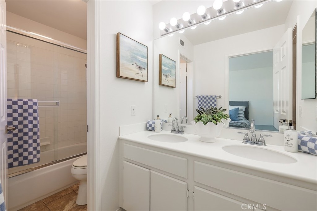 41 Castletree Rancho Santa Margarita, CA 92688 - Photo 49 of 68 a bathroom with a sink a toilet and shower
