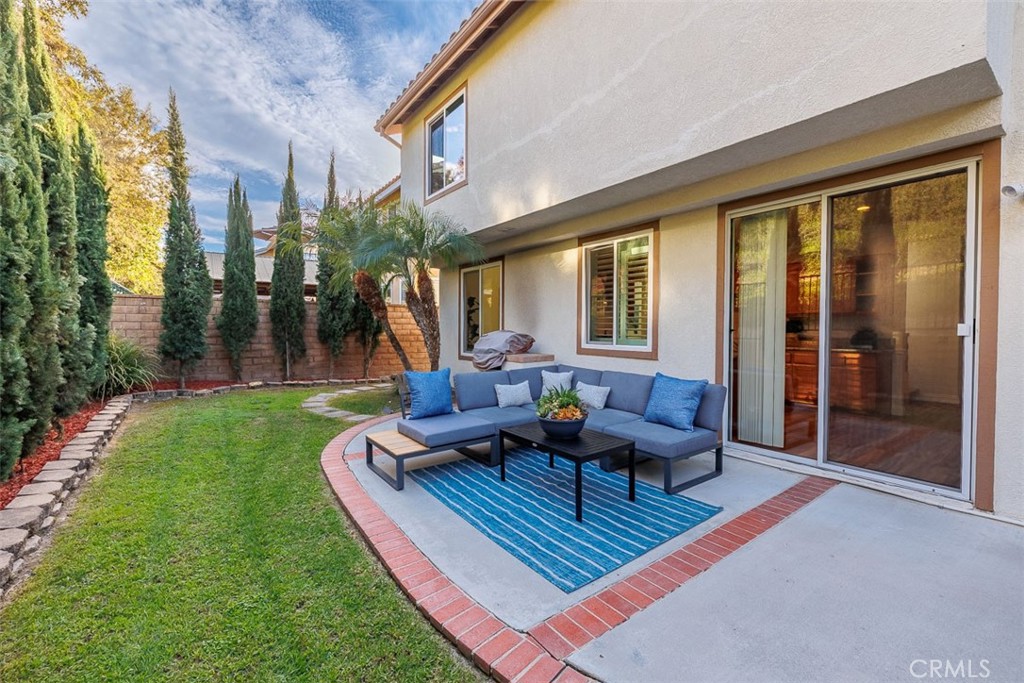41 Castletree Rancho Santa Margarita, CA 92688 - Photo 51 of 68 a view of a house with backyard sitting area and garden