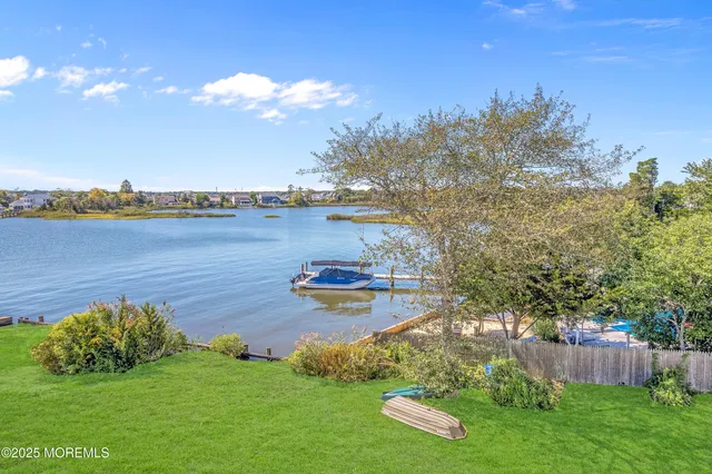 a view of a lake with a big yard
