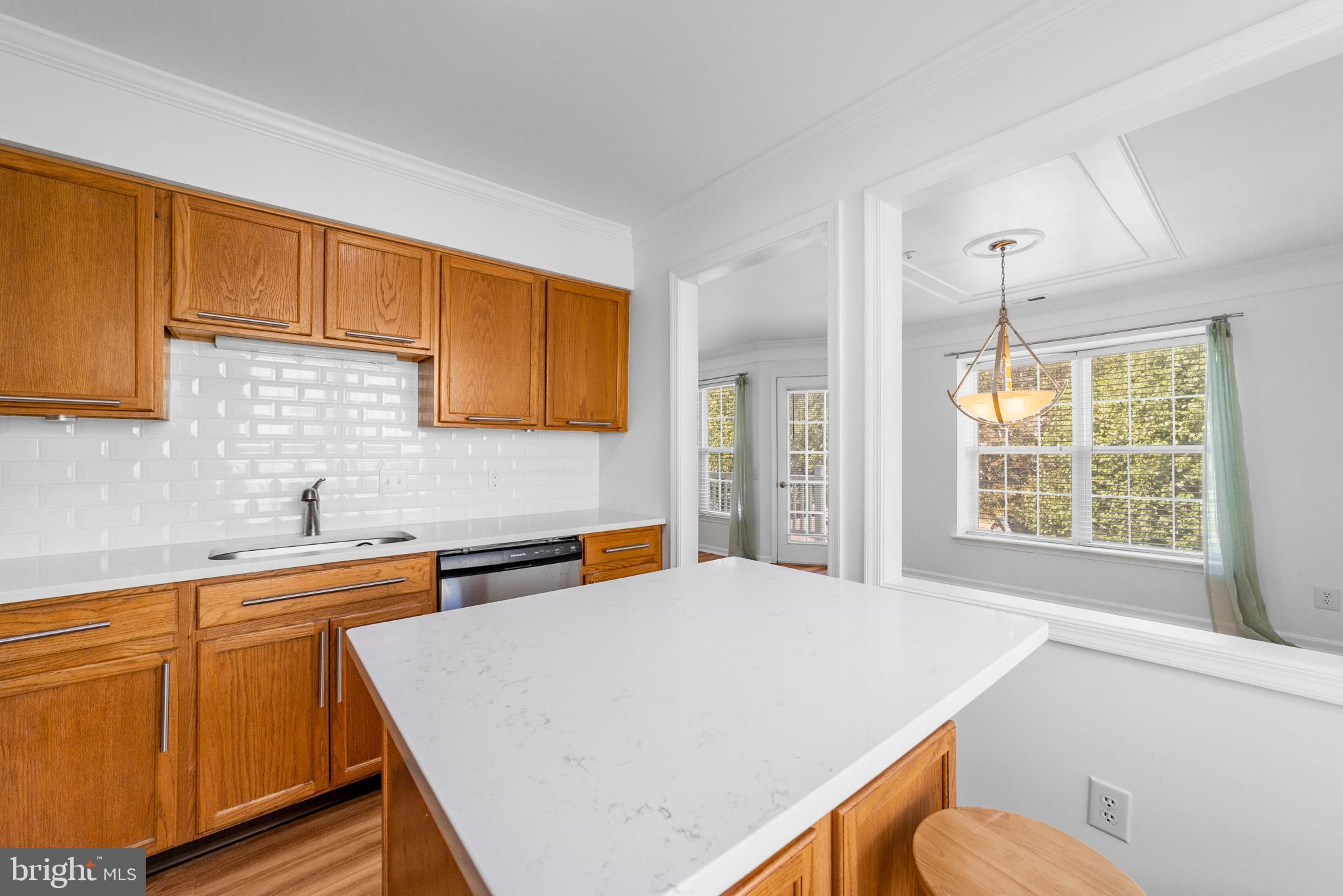 1010 Crestmont Drive Mantua, NJ 08051 - Photo 12 of 25 a kitchen with stainless steel appliances a sink a stove a refrigerator cabinets and a window