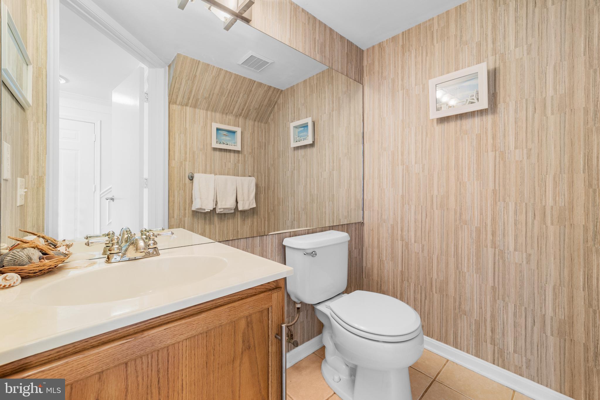 1010 Crestmont Drive Mantua, NJ 08051 - Photo 17 of 25 a bathroom with a sink a toilet and mirror