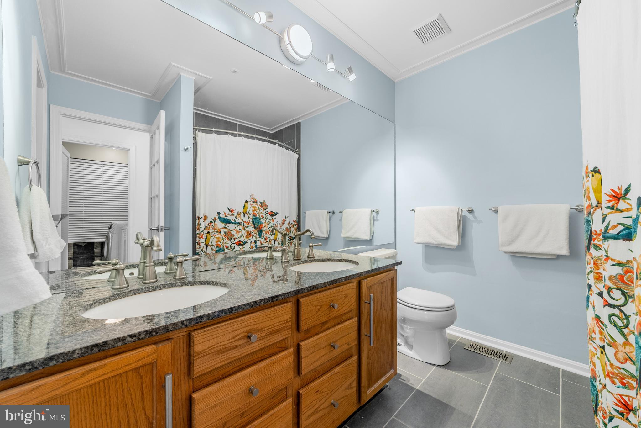 1010 Crestmont Drive Mantua, NJ 08051 - Photo 24 of 25 a bathroom with a granite countertop sink a toilet and a mirror