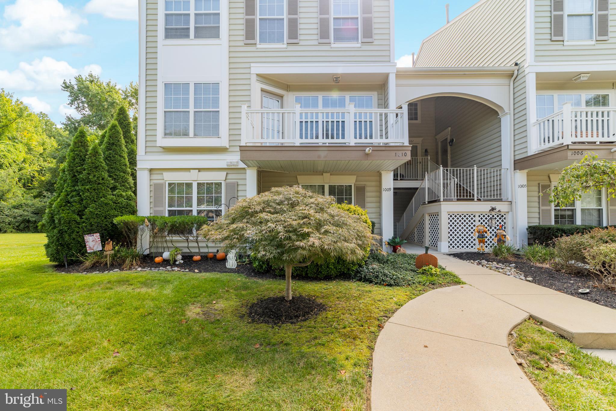 1010 Crestmont Drive Mantua, NJ 08051 - Photo 4 of 25 a front view of a house with a yard