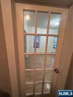 a bathroom with a glass shower door