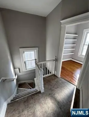 a view of staircase with a rug