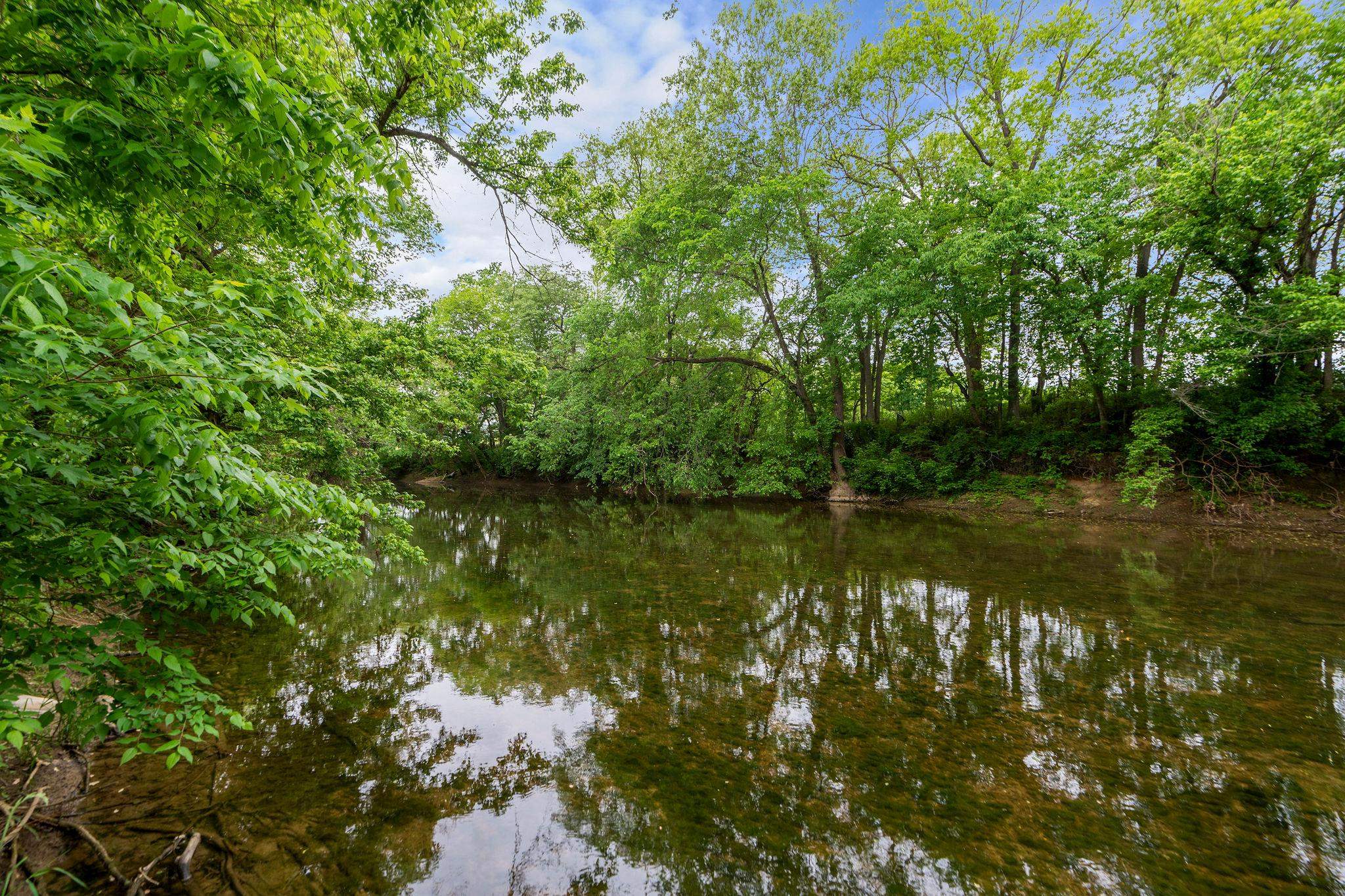 216 Lee Roy Road Grottoes, VA 24441 - Photo 58 of 64 a view of lake with green space