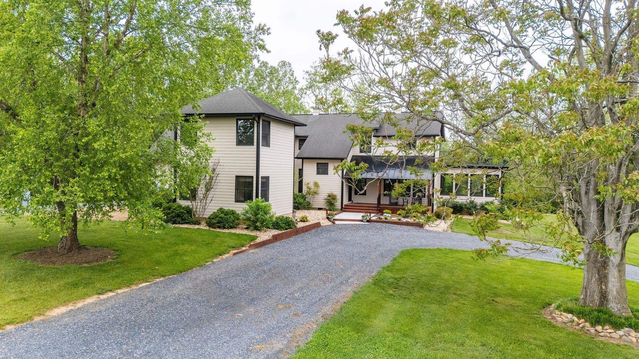 216 Lee Roy Road Grottoes, VA 24441 - Photo 6 of 64 a front view of a house with garden