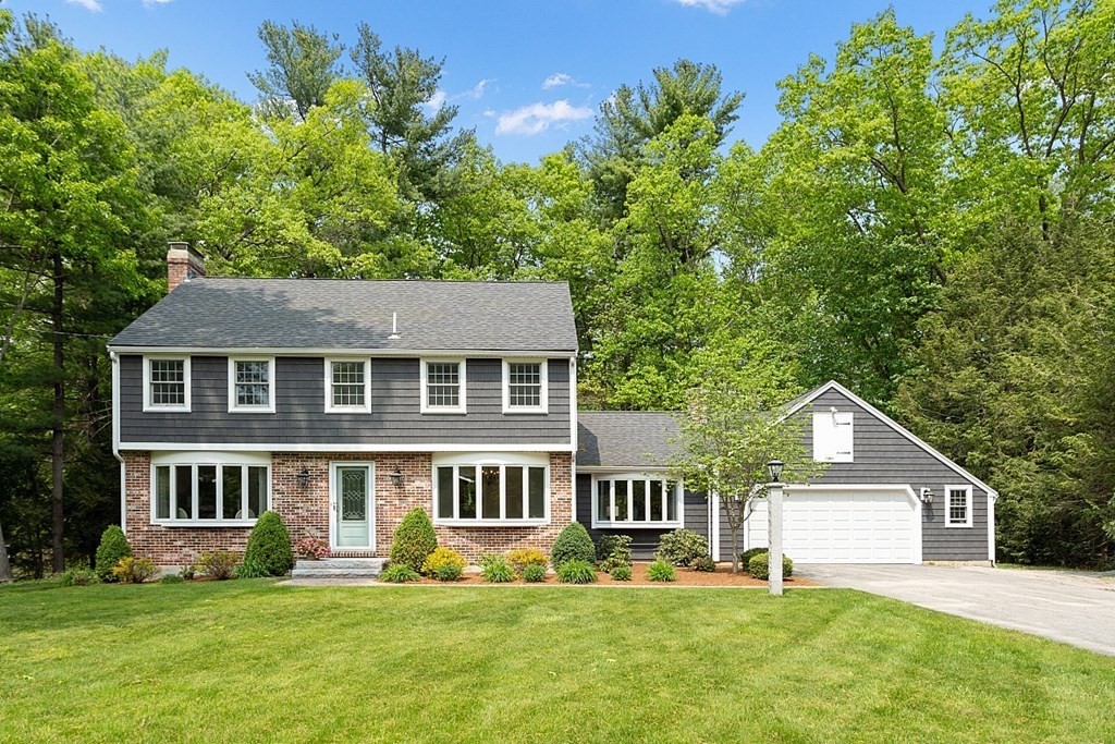 18 Higate Road Chelmsford, MA 01824 - Photo 1 of 39 a front view of a house with a yard and trees