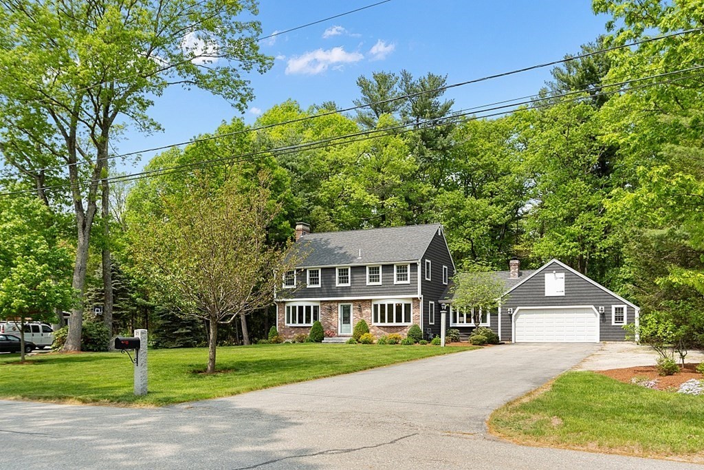 18 Higate Road Chelmsford, MA 01824 - Photo 3 of 39 a view of a big house with a big yard and large trees