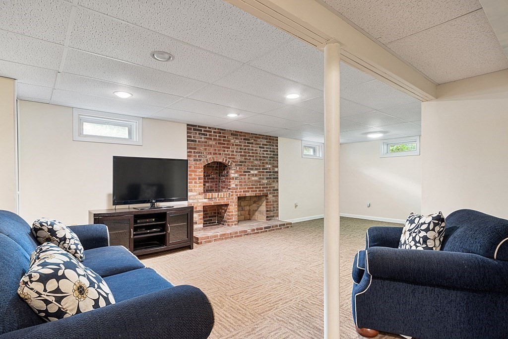 18 Higate Road Chelmsford, MA 01824 - Photo 33 of 39 a living room with furniture and a flat screen tv