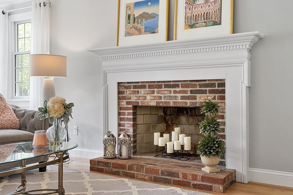 18 Higate Road Chelmsford, MA 01824 - Photo 7 of 39 a living room with furniture and a fireplace