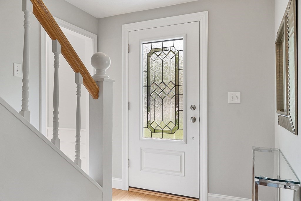 18 Higate Road Chelmsford, MA 01824 - Photo 8 of 39 a view of entryway with wooden floor and stair