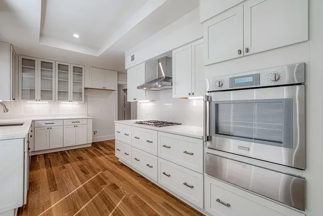 a kitchen with cabinets and appliances
