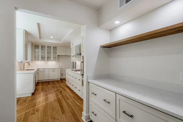 a kitchen with sink cabinets and refrigerator