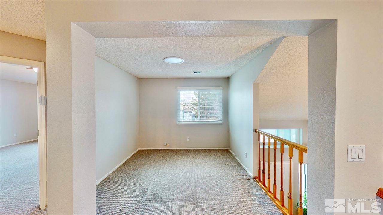5380 Simons Drive Reno, NV 89523 - Photo 16 of 34 a view of a hallway with a window