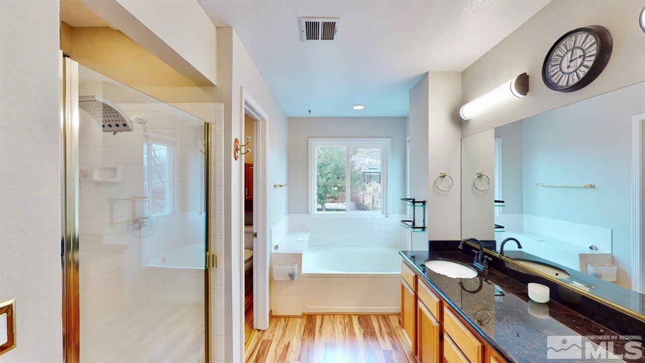 5380 Simons Drive Reno, NV 89523 - Photo 23 of 34 a view of a hallway with furniture and wooden floor