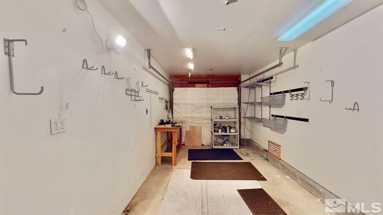 5380 Simons Drive Reno, NV 89523 - Photo 32 of 34 a room with lots of white walls and cabinets