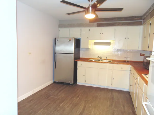a kitchen with a refrigerator a sink and dishwasher