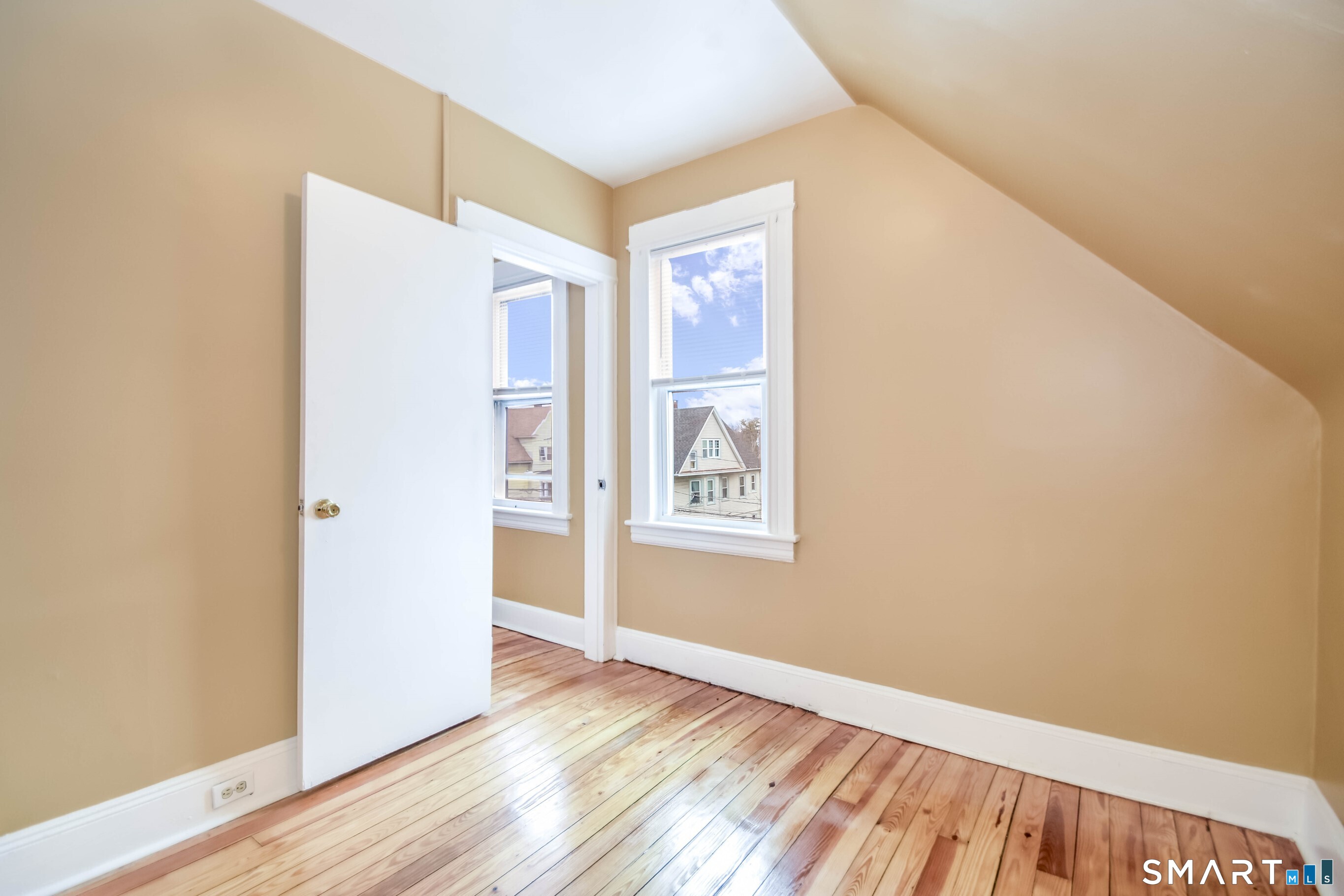 201 French Street Bridgeport, CT 06606 - Photo 9 of 30 a view of an empty room with wooden floor and a window