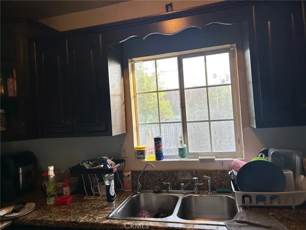 a kitchen with a sink and a window