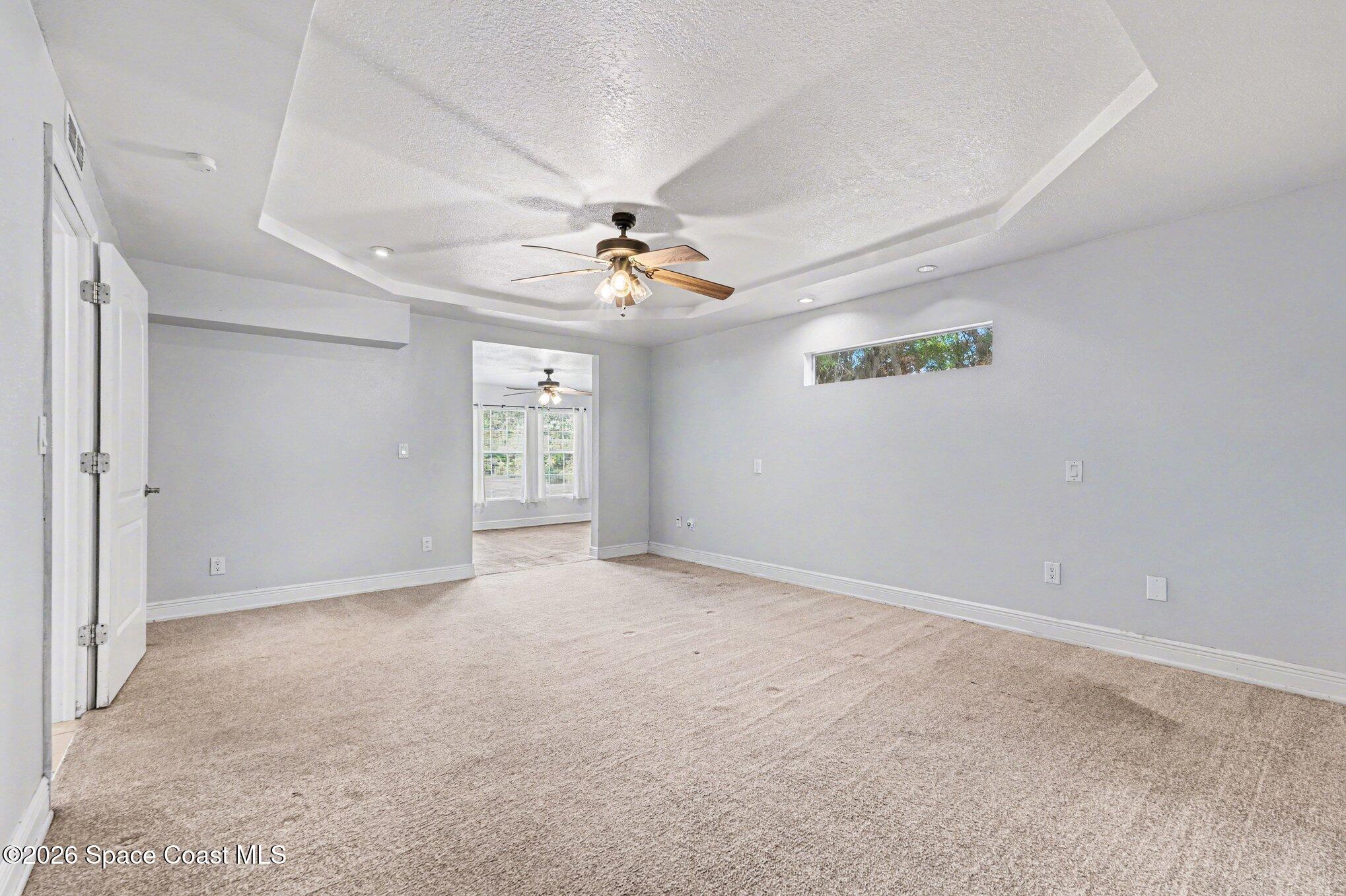 4950 Blounts Ridge Road Mims, FL 32754 - Photo 6 of 40 a view of an empty room with a window