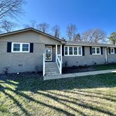 a house view with a garden space