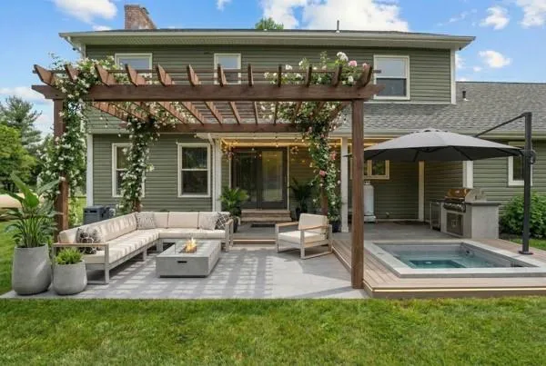 a view of a house with patio and a yard