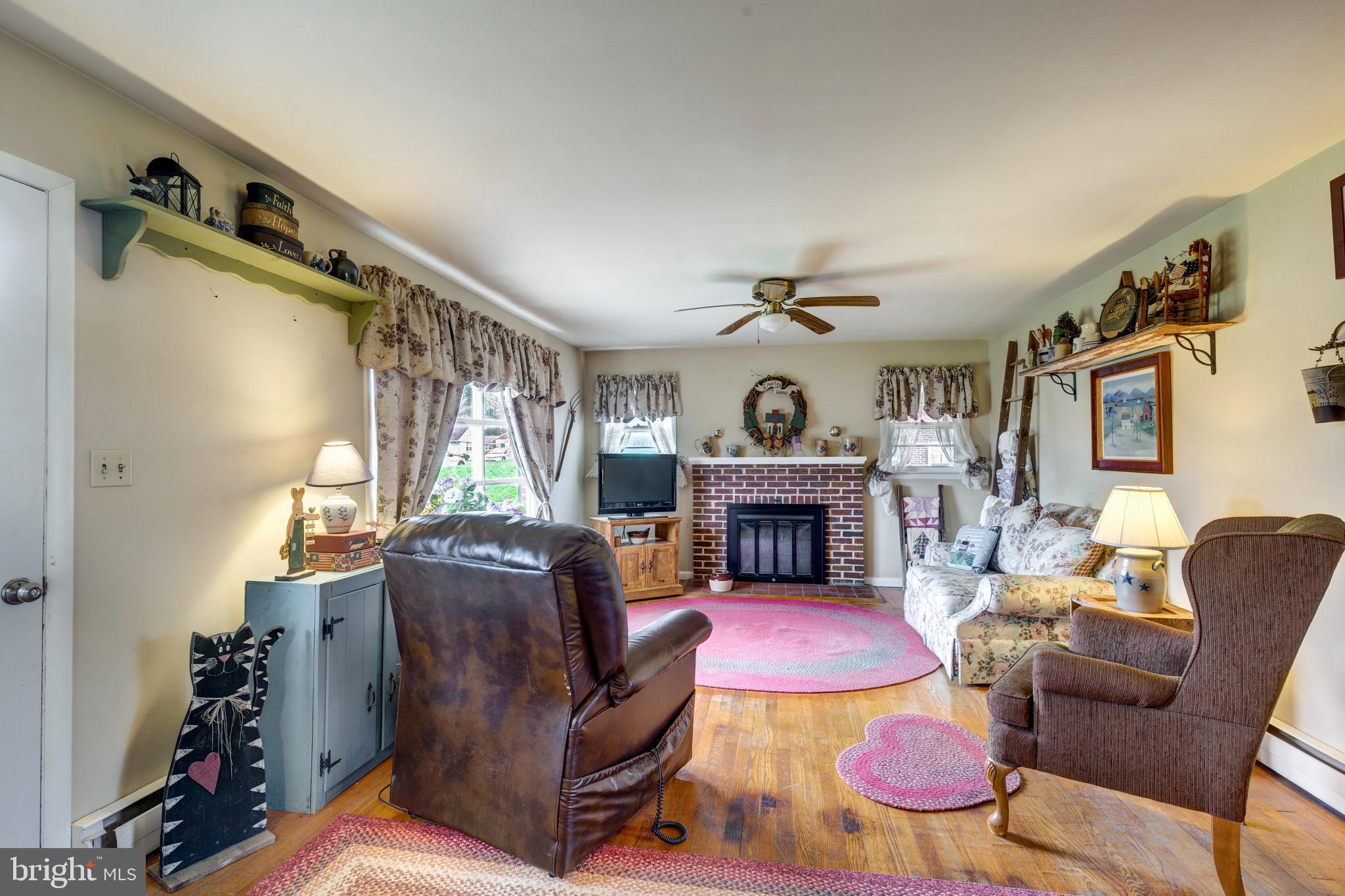 804 William Avenue Westminster, MD 21157 - Photo 2 of 20 a living room with furniture fireplace and flat screen tv