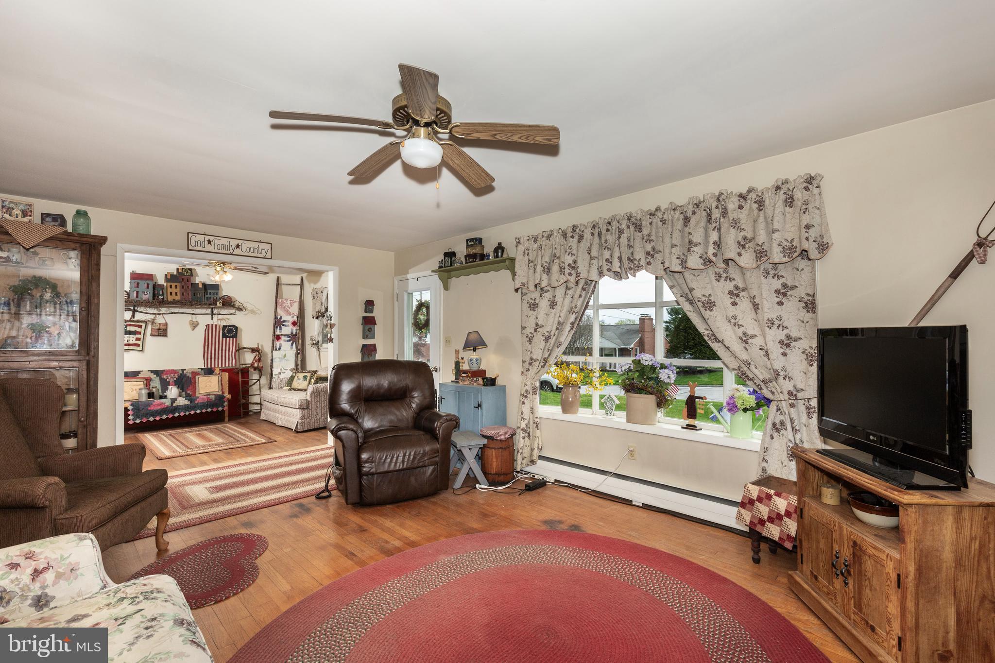 804 William Avenue Westminster, MD 21157 - Photo 3 of 20 a living room with furniture and a flat screen tv