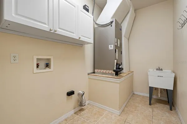a bathroom with a sink a mirror and vanity