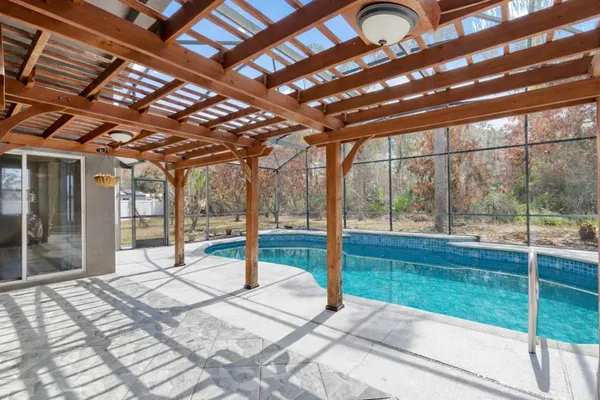 a view of swimming pool with a backyard