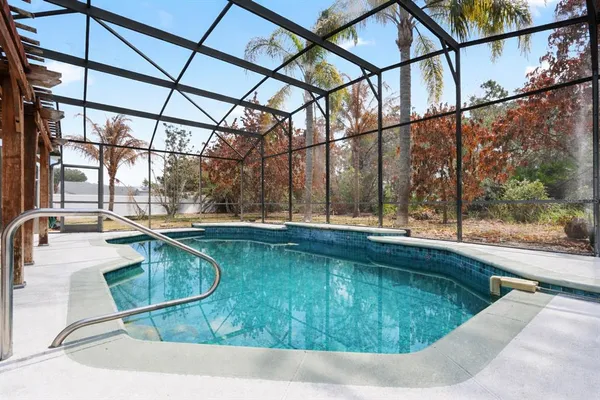 a view of a swimming pool with a porch