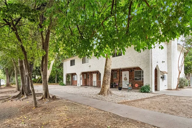 front view of a house with a tree