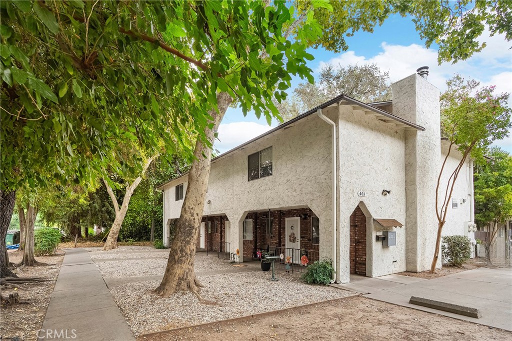 403 Maple Street Chico, CA 95928 - Photo 4 of 18 a front view of a house with garden