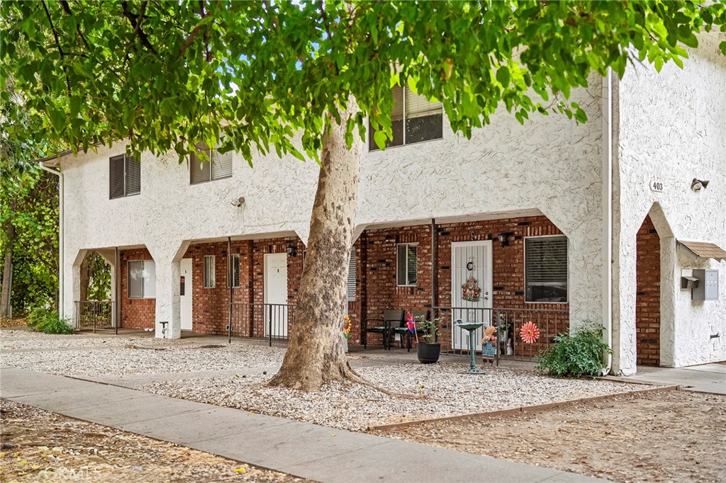 403 Maple Street Chico, CA 95928 - Photo 6 of 18 a front view of a house with garden and plants