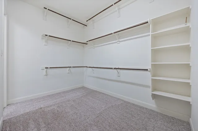 a view of an empty walk in closet