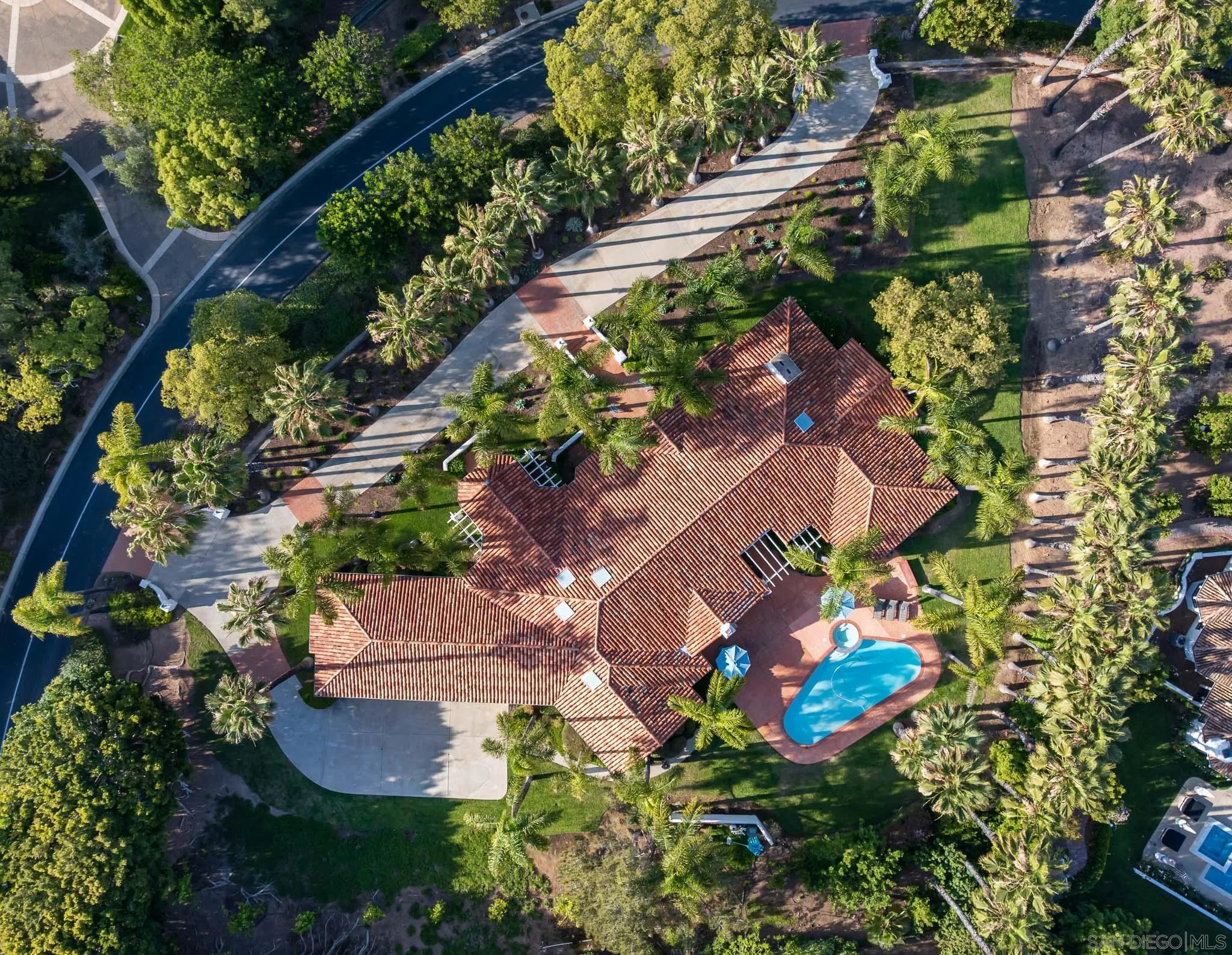 18221 Via Ascenso Rancho Santa Fe, CA 92067 - Photo 28 of 37 an aerial view of a house with a yard and garden