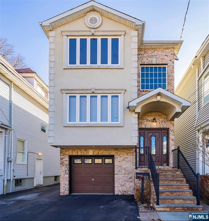 312 Vine Street Elizabeth, NJ 07202 - Photo 1 of 10 a front view of a house with balcony