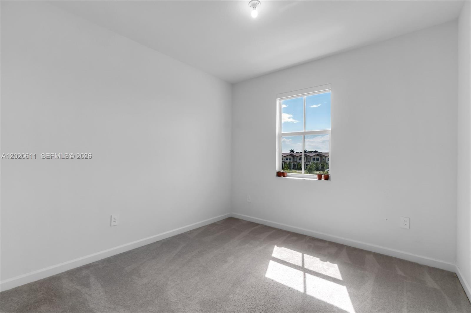 26455 Southwest 148th Avenue Homestead, FL 33032 - Photo 20 of 35 an empty room with a window