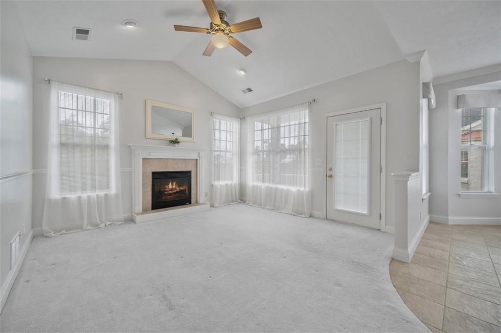 246 Adams Pointe Boulevard, Unit 1 Mars, PA 16046 - Photo 18 of 37 a view of empty room with window and fireplace