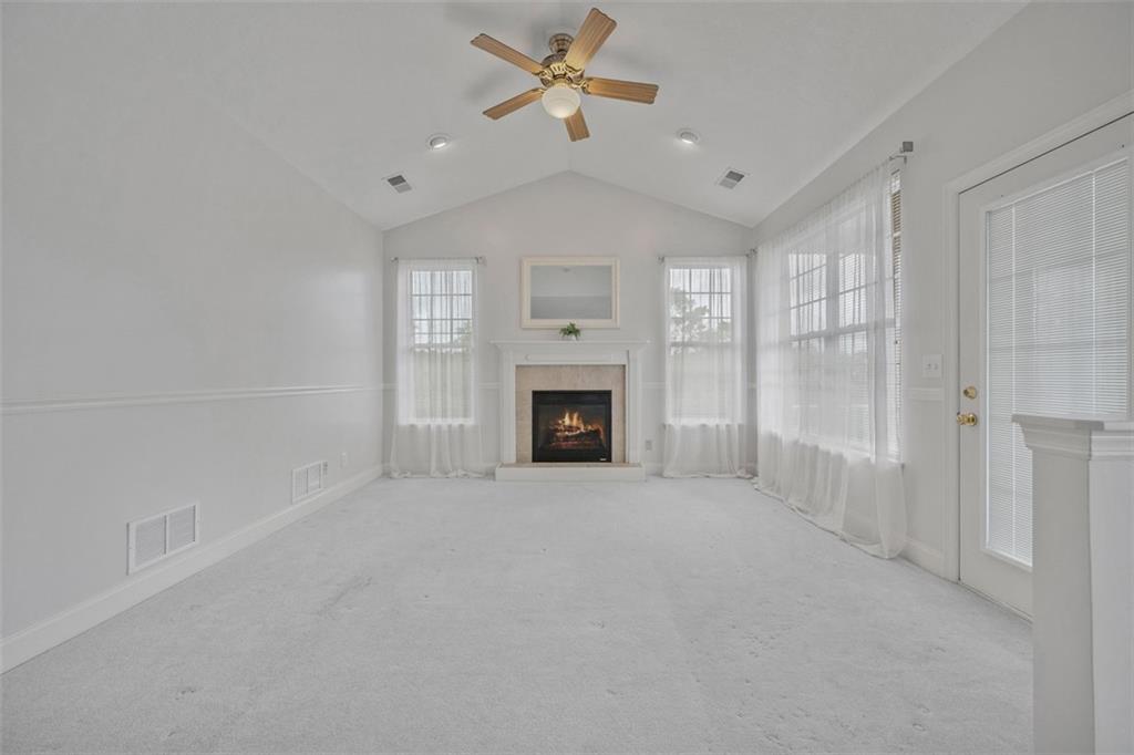246 Adams Pointe Boulevard, Unit 1 Mars, PA 16046 - Photo 19 of 37 a big room with chandelier fan and windows