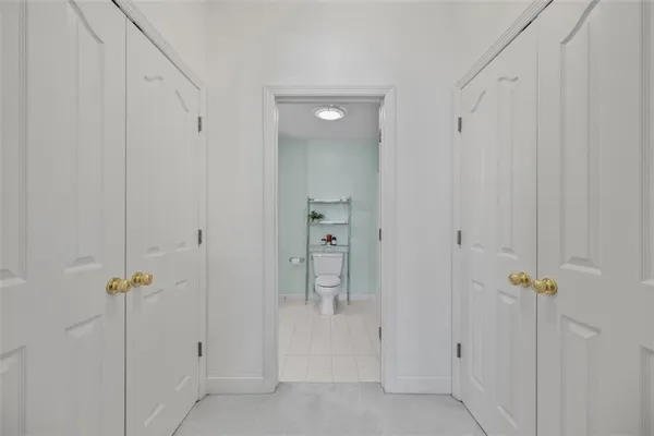 a living room with furniture and a ceiling fan