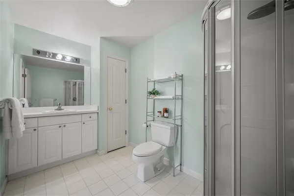 a spacious bedroom with a bed and a window