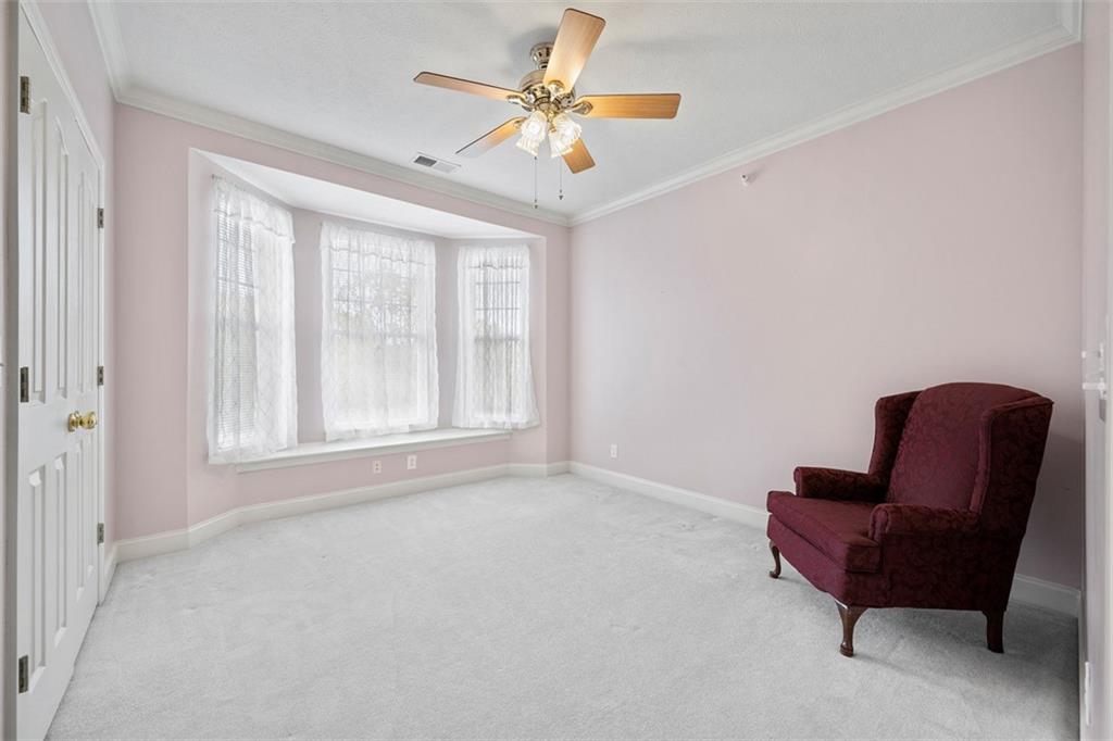 246 Adams Pointe Boulevard, Unit 1 Mars, PA 16046 - Photo 26 of 37 a living room with furniture and a ceiling fan