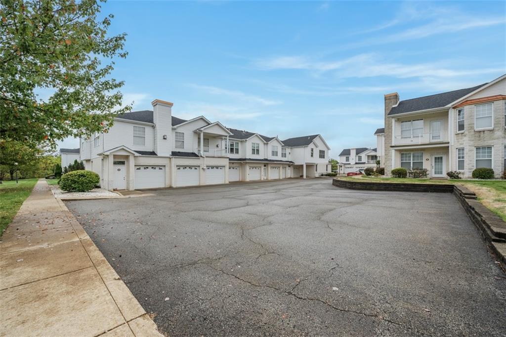 246 Adams Pointe Boulevard, Unit 1 Mars, PA 16046 - Photo 31 of 37 a view of a city street with house