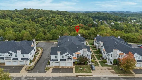 a view of a kitchen with a microwave and cabinets