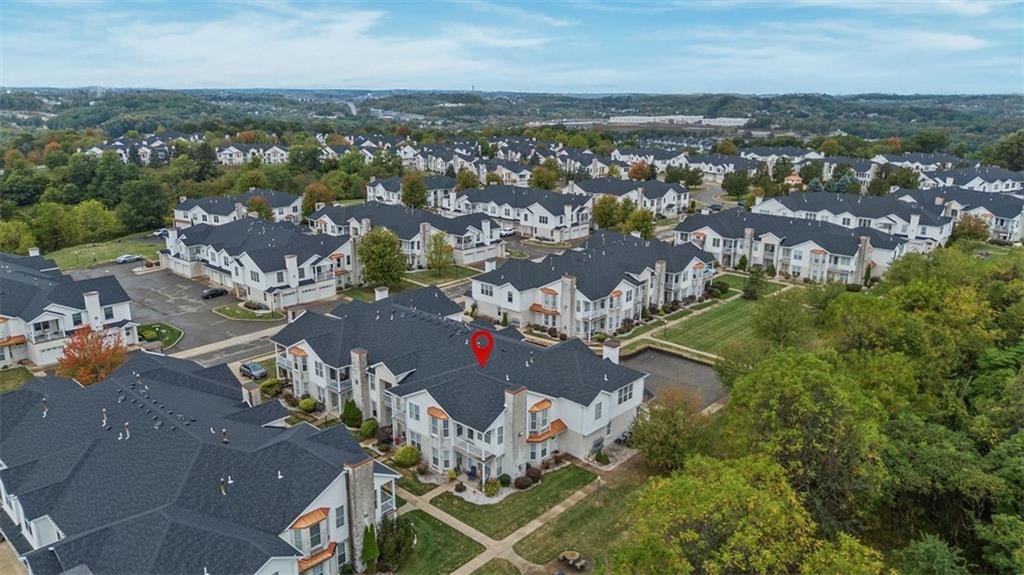 246 Adams Pointe Boulevard, Unit 1 Mars, PA 16046 - Photo 33 of 37 an aerial view of a city with lots of residential buildings