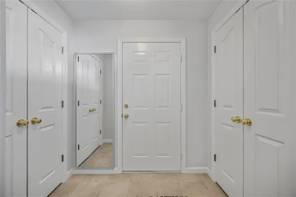 a kitchen with stainless steel appliances granite countertop a refrigerator a stove and a sink