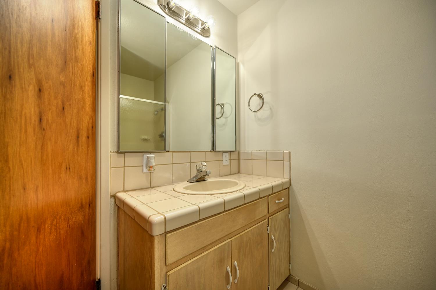 4541 Meadowbrook Road Garden Valley, CA 95633 - Photo 43 of 71 bathroom featuring vanity, a shower stall, and tasteful backsplash